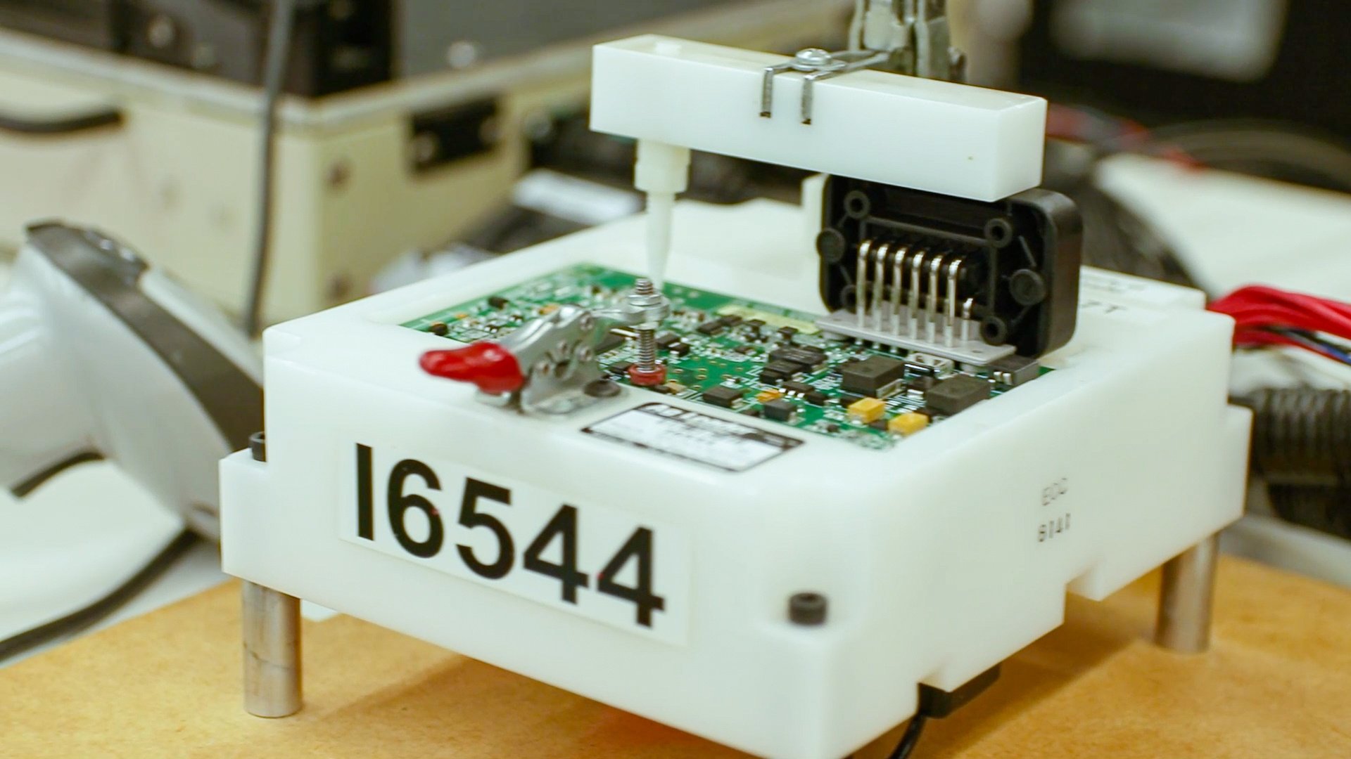 A PCB at RIS undergoes a shock and vibration test.