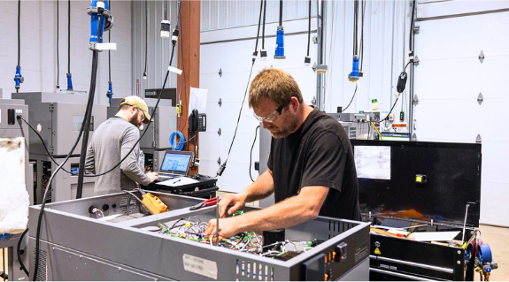 RIS production workers run tests on completed box builds to ensure top quality.