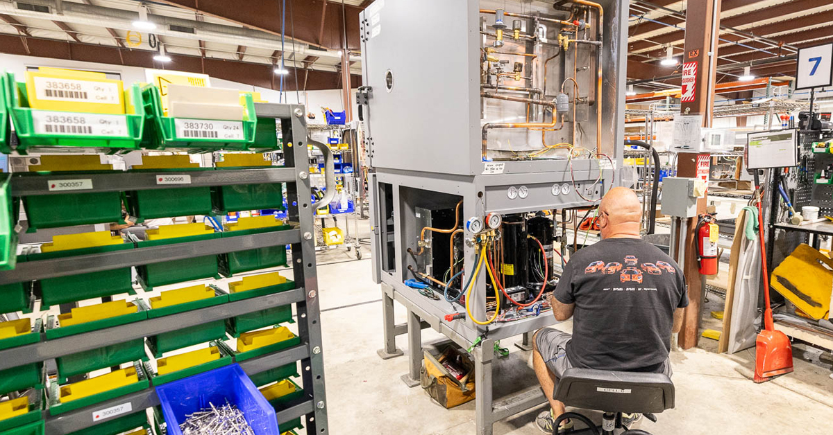 RIS worker doing assembly on a large, complex assembly.