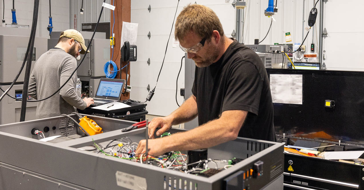 RIS production workers run tests on completed box builds to ensure top quality.